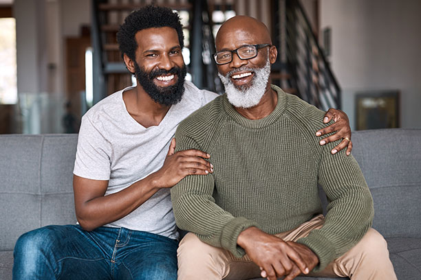African American father and son sitting together